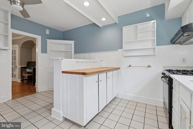 7527 Germantown Ave, Philadelphia, PA 19119 - kitchen featuring black range with gas cooktop, open shelves, exhaust hood, a ceiling fan, and a wainscoted wall