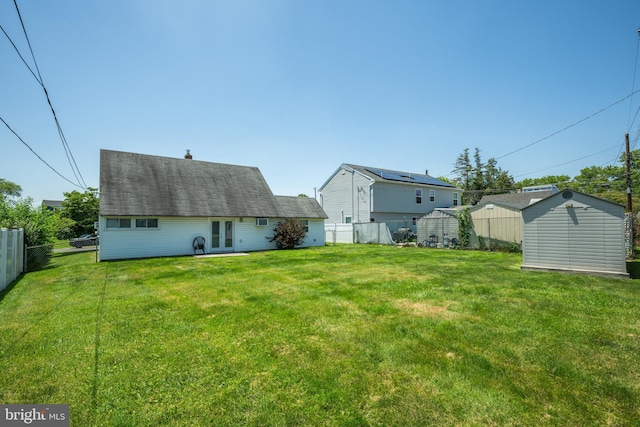 54 Apricot Ln, Levittown, PA 19055 - rear view of house with a storage shed, french doors, and a shingled roof