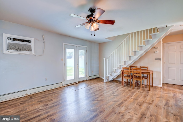 54 Apricot Ln, Levittown, PA 19055 - living room with stairway, wood finished floors, ceiling fan, and a baseboard radiator