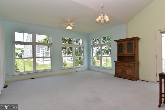 36765 Hummingbird Way N, Selbyville, DE 19975 - unfurnished living room featuring light carpet, a chandelier, and a ceiling fan