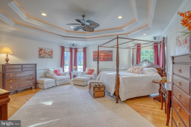 156 E Buckingham Dr, Rehoboth Beach, DE 19971 - bedroom featuring a tray ceiling, ornamental molding, light wood-style floors, recessed lighting, and a ceiling fan