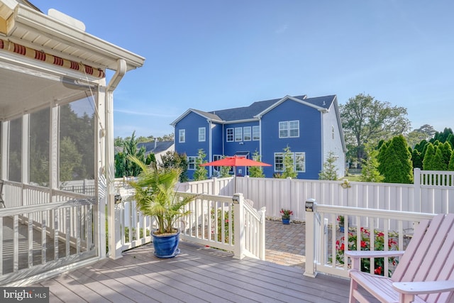 156 E Buckingham Dr, Rehoboth Beach, DE 19971 - wooden terrace with a sunroom