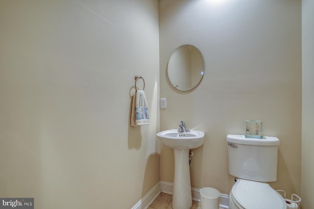 156 E Buckingham Dr, Rehoboth Beach, DE 19971 - half bathroom with toilet and tile patterned floors
