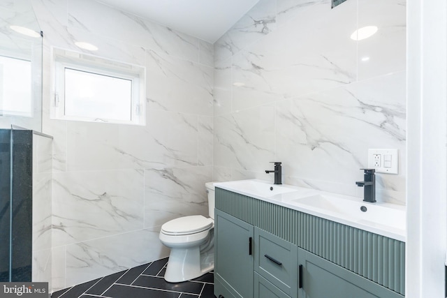2713 E Huntingdon St, Philadelphia, PA 19125 - bathroom with tile walls, double vanity, and tile patterned floors
