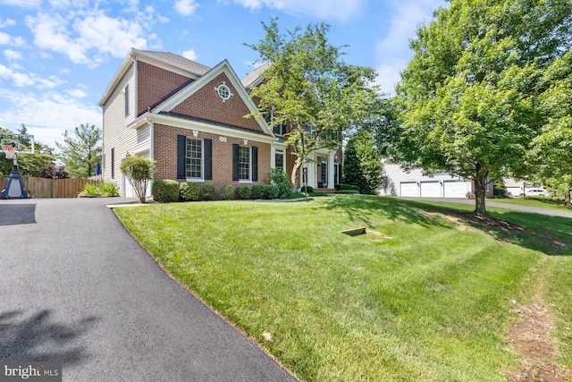 20736 Ashburn Station Pl, Ashburn, VA 20147 - view of front facade with brick siding, asphalt driveway, and a garage