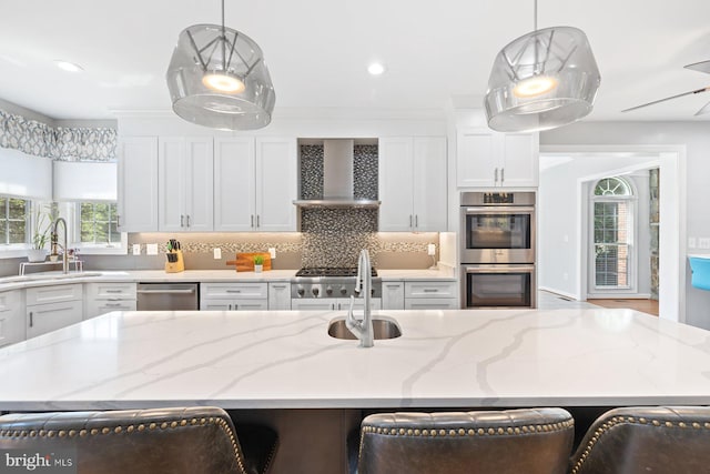 20736 Ashburn Station Pl, Ashburn, VA 20147 - kitchen with white cabinets, wall chimney exhaust hood, backsplash, and recessed lighting
