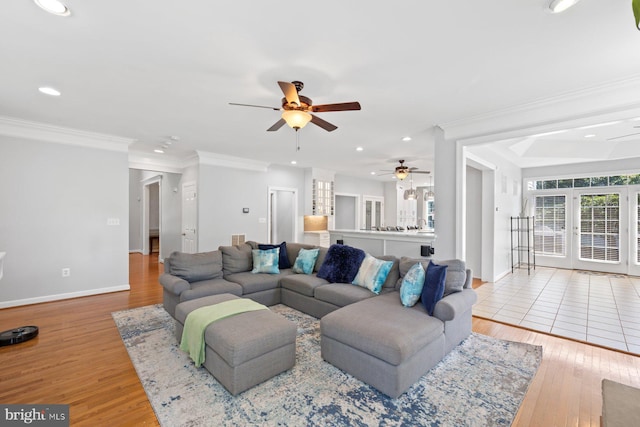 20736 Ashburn Station Pl, Ashburn, VA 20147 - living area with a ceiling fan, recessed lighting, wood finished floors, crown molding, and french doors