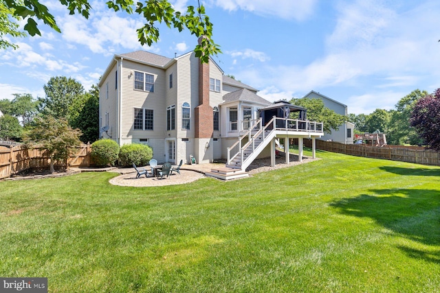 20736 Ashburn Station Pl, Ashburn, VA 20147 - back of house featuring a chimney, stairway, a patio area, and a fenced backyard