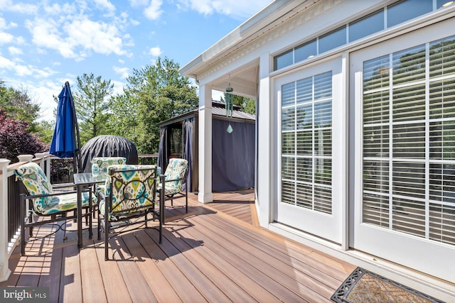 20736 Ashburn Station Pl, Ashburn, VA 20147 - wooden terrace with outdoor dining area and a gazebo
