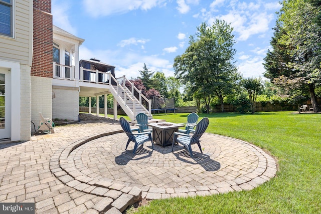 20736 Ashburn Station Pl, Ashburn, VA 20147 - view of patio / terrace featuring stairs, a trampoline, and an outdoor fire pit