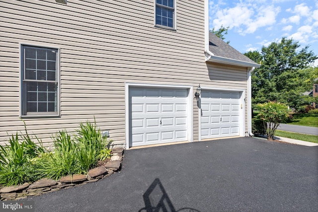 20736 Ashburn Station Pl, Ashburn, VA 20147 - garage featuring driveway