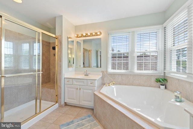 20736 Ashburn Station Pl, Ashburn, VA 20147 - bathroom with vanity, a garden tub, a shower stall, and tile patterned floors