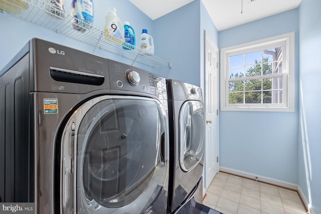 20736 Ashburn Station Pl, Ashburn, VA 20147 - laundry area with baseboards and washer and clothes dryer