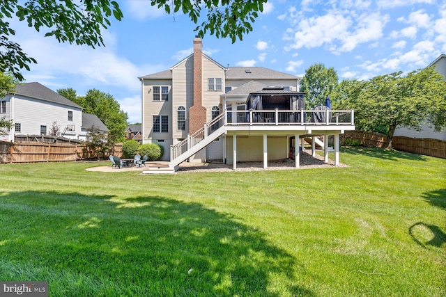 20736 Ashburn Station Pl, Ashburn, VA 20147 - back of house with stairs, a wooden deck, a fenced backyard, a fire pit, and a chimney