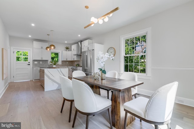 6818 Connecticut Ave, Chevy Chase, MD 20815 - dining room featuring light wood finished floors and recessed lighting