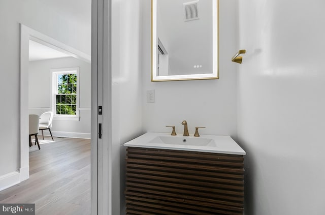 6818 Connecticut Ave, Chevy Chase, MD 20815 - bathroom with vanity and wood finished floors