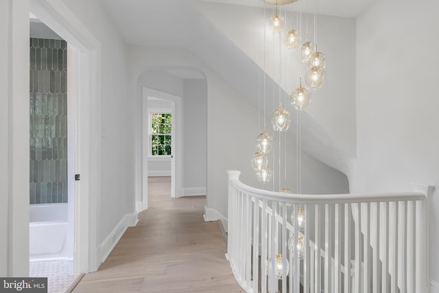 6818 Connecticut Ave, Chevy Chase, MD 20815 - corridor featuring wood finished floors and arched walkways