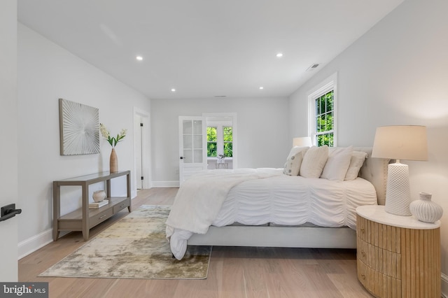 6818 Connecticut Ave, Chevy Chase, MD 20815 - bedroom with light wood-style flooring and recessed lighting