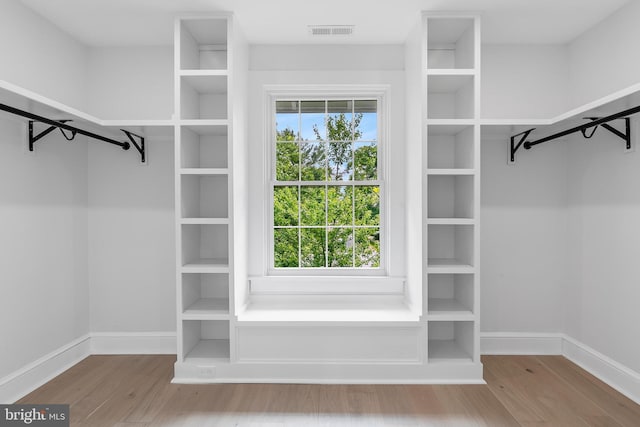 6818 Connecticut Ave, Chevy Chase, MD 20815 - walk in closet featuring wood finished floors