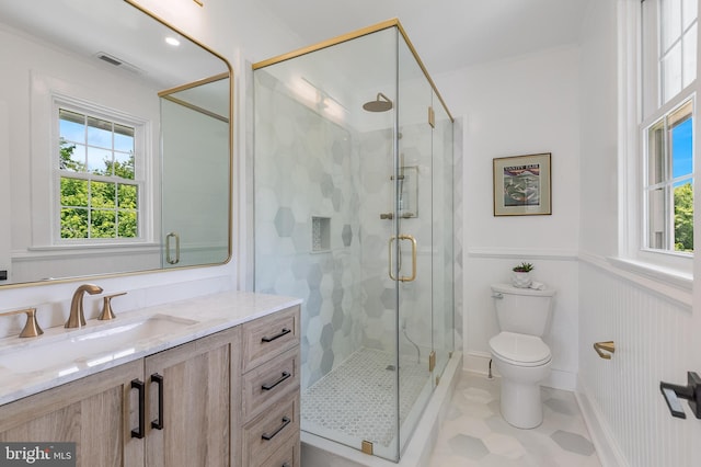 6818 Connecticut Ave, Chevy Chase, MD 20815 - full bathroom featuring vanity, a shower stall, and a wainscoted wall