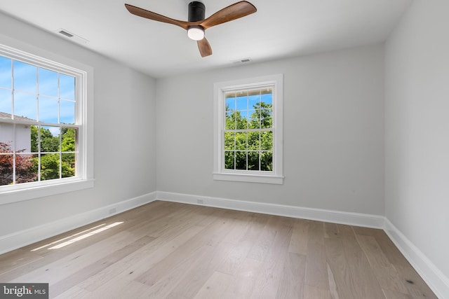 6818 Connecticut Ave, Chevy Chase, MD 20815 - spare room featuring plenty of natural light, wood finished floors, and a ceiling fan