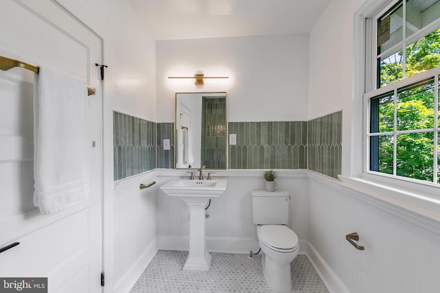 6818 Connecticut Ave, Chevy Chase, MD 20815 - bathroom featuring wainscoting and tile patterned flooring