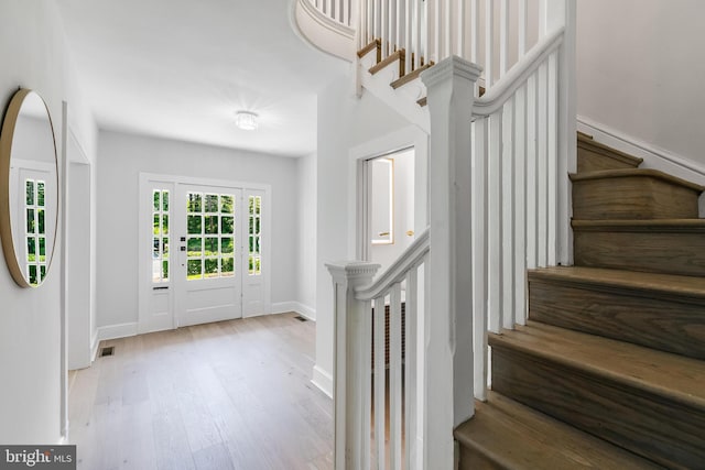 6818 Connecticut Ave, Chevy Chase, MD 20815 - foyer entrance featuring stairs and wood finished floors