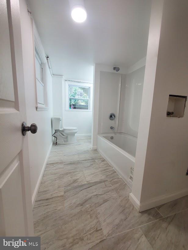 129 Haines St, Browns Mills, NJ 08015 - full bathroom featuring bathing tub / shower combination and marble look tiles