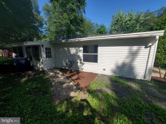 129 Haines St, Browns Mills, NJ 08015 - rear view of house with a patio and a sunroom