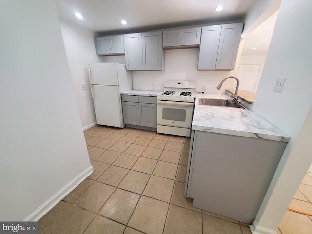 129 Haines St, Browns Mills, NJ 08015 - kitchen with white appliances, gray cabinets, light tile patterned flooring, recessed lighting, and light stone counters