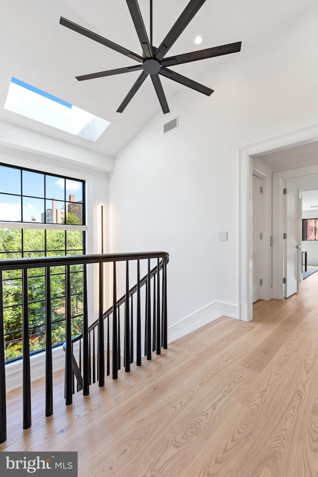 3119 38th St NW, Washington, DC 20016 - corridor featuring a skylight, light wood-style flooring, vaulted ceiling, and recessed lighting