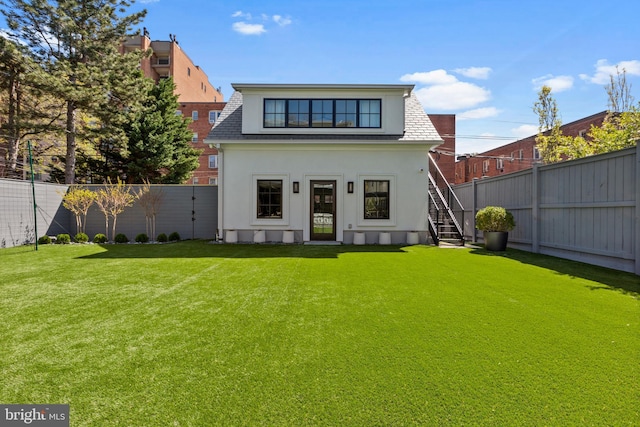 3119 38th St NW, Washington, DC 20016 - back of house with a fenced backyard, stairs, stucco siding, and roof with shingles