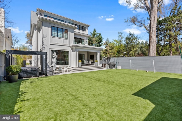 3119 38th St NW, Washington, DC 20016 - back of property featuring a hot tub, a fenced backyard, a patio area, and stucco siding