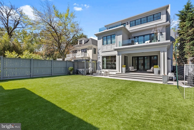3119 38th St NW, Washington, DC 20016 - back of property featuring a fenced backyard, a balcony, a patio area, and stucco siding