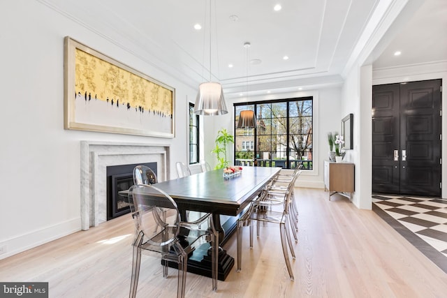 3119 38th St NW, Washington, DC 20016 - dining area featuring a premium fireplace, light wood-style flooring, recessed lighting, and ornamental molding