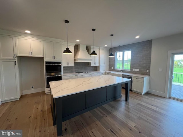 937 Swinehart Rd Unit C, Boyertown, PA 19512 - kitchen featuring custom range hood, stainless steel double oven, dishwasher, tasteful backsplash, and white cabinetry