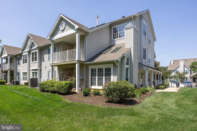 703 Wharton Rd, Mount Laurel, NJ 08054 - rear view of house with a yard, a balcony, and a shingled roof
