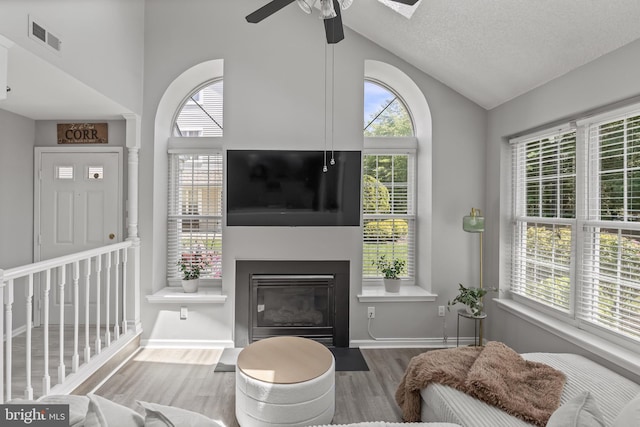 703 Wharton Rd, Mount Laurel, NJ 08054 - living room featuring wood finished floors, a ceiling fan, a fireplace with flush hearth, and high vaulted ceiling
