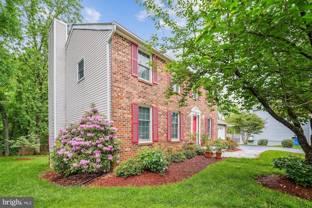 14616 Orangewood St, Silver Spring, MD 20905 - view of front of home featuring a chimney, brick siding, and an attached garage