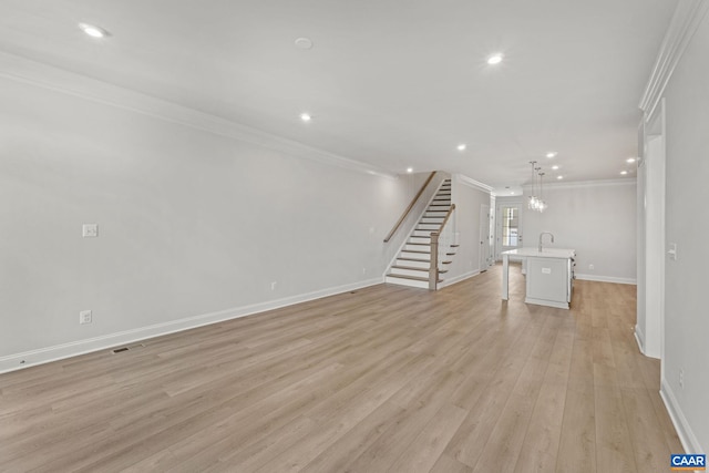 103 Laconia Ln, Charlottesville, VA 22911 - unfurnished living room with ornamental molding, stairway, recessed lighting, and light wood-style flooring
