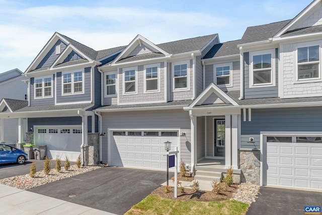 103 Laconia Ln, Charlottesville, VA 22911 - view of property featuring an attached garage, asphalt driveway, and stone siding
