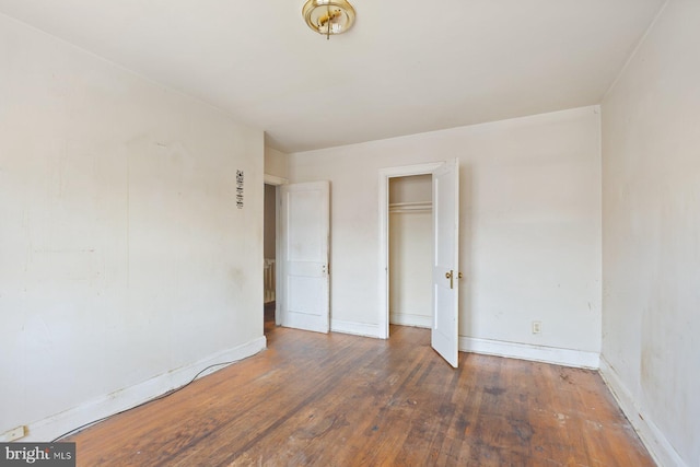 11 Rosedale St, Baltimore, MD 21229 - unfurnished bedroom with hardwood / wood-style floors and a closet