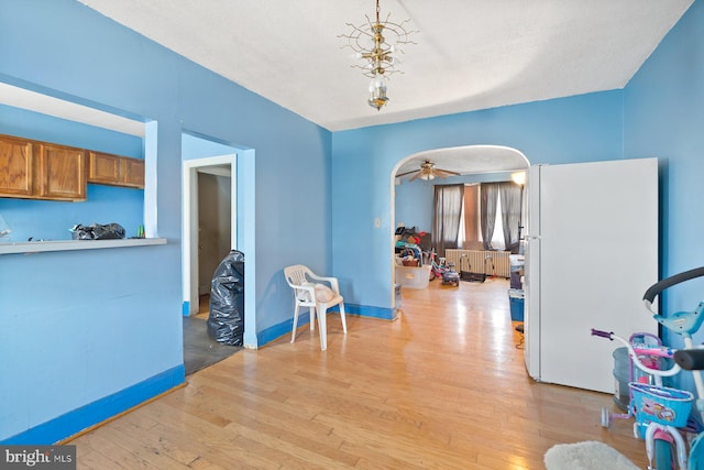 11 Rosedale St, Baltimore, MD 21229 - sitting room with light wood finished floors and ceiling fan