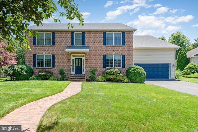 3 Baird Ct, Carlisle, PA 17013 - colonial-style house featuring concrete driveway, an attached garage, a front yard, and brick siding