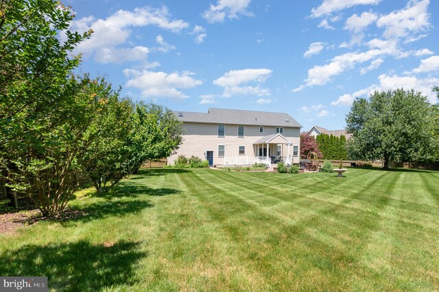 3 Baird Ct, Carlisle, PA 17013 - rear view of house with a lawn and a patio area