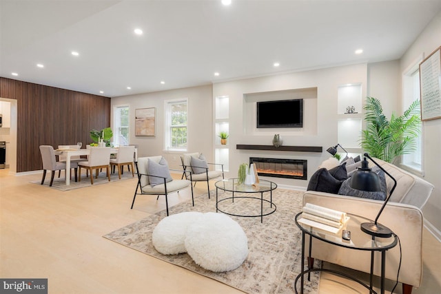 4618 Arabia Ave, Baltimore, MD 21214 - living room featuring recessed lighting, a glass covered fireplace, and wooden walls