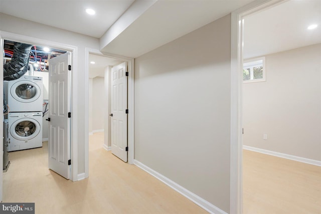 4618 Arabia Ave, Baltimore, MD 21214 - laundry room featuring stacked washer / dryer and light wood finished floors