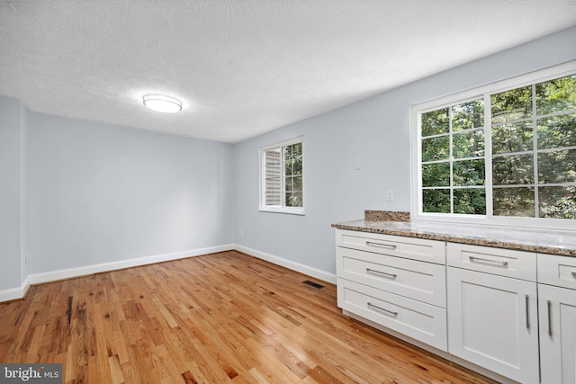 1632 Barnstead Dr, Reston, VA 20194 - spare room featuring light wood finished floors and a textured ceiling
