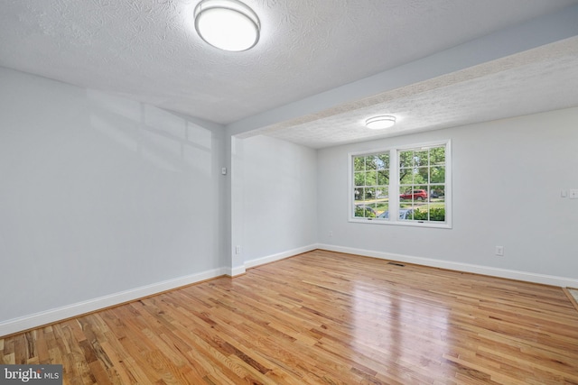 1632 Barnstead Dr, Reston, VA 20194 - unfurnished room featuring light wood finished floors and a textured ceiling