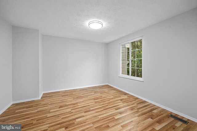 1632 Barnstead Dr, Reston, VA 20194 - empty room featuring wood finished floors and a textured ceiling